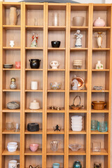 Sweden, Malmo – July 8, 2023: European vintage second hand with many beautiful unusual things, porcelain, bijouterie, jewelery. Flea market, garage sale.