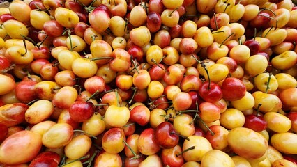 Abundance of ripe cherries in the market.