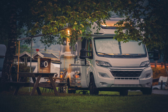 Modern RV Camper Van and a Camping Spot