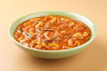 Mix vegetable curry - Indian main course recipe contains Carrots, cauliflower, green peas and beans, baby corn, capsicum and paneer/cottage cheese with traditional masala and curry, selective focus