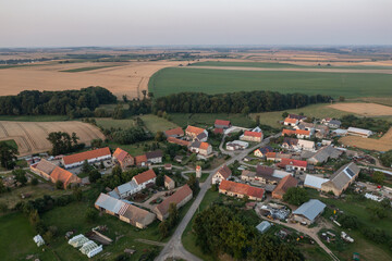 Village from drone aerial view. Beautiful village with houses and fields in Nysa, Poland. Polish farmland.