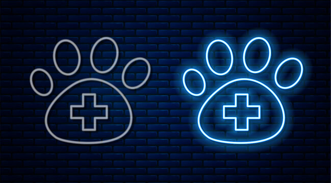 Glowing neon line Veterinary clinic symbol icon isolated on brick wall background. Cross hospital sign. A stylized paw print dog or cat. Pet First Aid sign. Vector