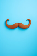 Fototapeta premium Blue november concept. Mustache isolated on a blue background. High quality photo