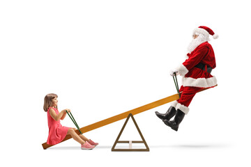 Santa Claus playing with a girl on a seesaw