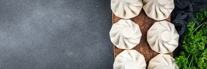 khinkali meat filling frozen product semi finished Georgian cuisine food meal food snack on the table copy space food background rustic top view