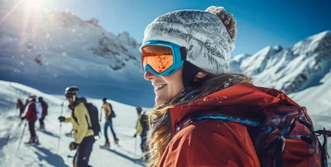 Poster Gruppe von Touristen beim Bergaufstieg im Winter, Fokus auf eine Frau im Vordergrund mit Skibrille, Strickmütze und roter Winterjacke. © Carmen Steiner