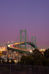 Vincent Thomas Bridge in Long Beach CA with the pier and the San Pedro shipping yard