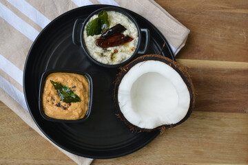 raw cut coconut with coconut chutney and lentil chutney for south Indian Idli or dosa. 