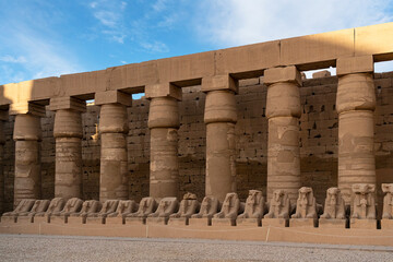 Karnak temple architecture of ancient Egypt with ram-headed and pharaoh statues, Luxor