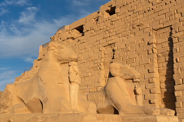 Karnak temple sphinxes alley -  architecture of ancient Egypt with ram-headed and pharaoh statues, Luxor