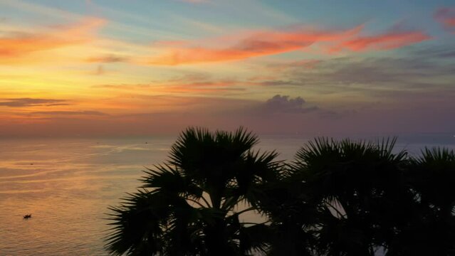.aerial view scenery colorful sunset above Promthep cape..stunning cloud in the beautiful sky above suger parm trees..Imagine a fantasy clouds changing in colorful sky..Dramatic Sky background.