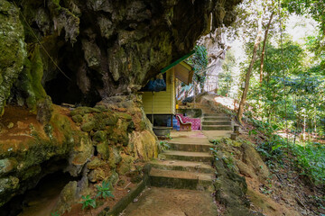Cliffside shacks of the Tiger Cave Temple (Wat Tham Sua) where buddhist monks retreat to meditate in the jungle of Krabi in the south of Thailand