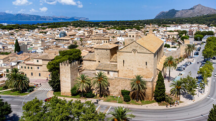 Aerial view of the roman catholic church of Sant Jaume in the medieval walled city of Alcudia on the Balearic island of Majorca (Spain) in the Mediterranean Sea