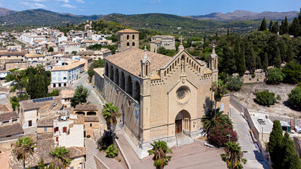 Fototapeta na wymiar Aerial view of the parish church of the Transfiguration of the Lord in the town of Artà on Majorca in the Balearic Islands, Spain
