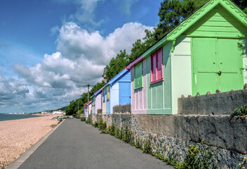 Fototapeta na wymiar Receding wooden beach huts