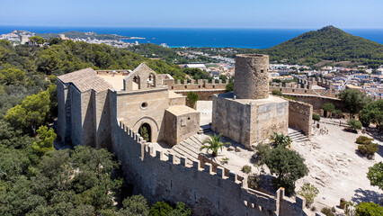Fototapeta na wymiar Castle of Capdepera on the Balearic island of Majorca in the Mediterranean Sea - Medieval walled fortress built on a slope covered with maquis