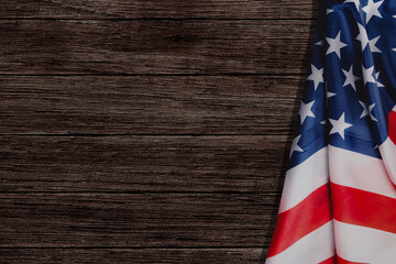 Stars and stripes American flag on rustic wooden background, copy space. The pride of the American...