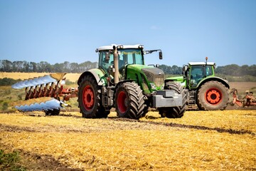 tractor with plow in field