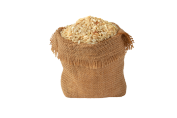 Brown whole grain rice in the jute canvas sack side view isolated transparent png. Uncooked,raw cereal.

