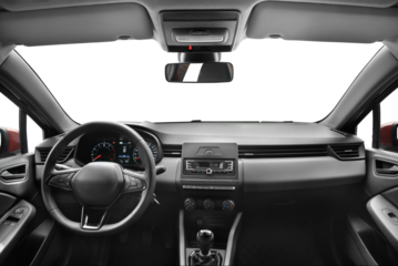 A photo captured from the middle of the back seat of a modern passenger car, showcasing the interior features such as steering wheel, gear shift, front windshield and dashboard