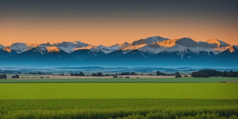 a huge landscape with mountains far and big crop farms in foreground at sunrise