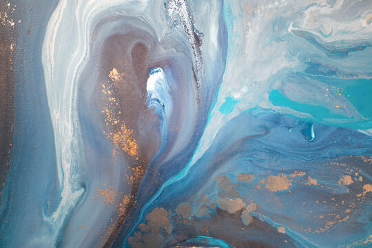 Abstract fluid acrylic painting. Marbled blue abstract background.