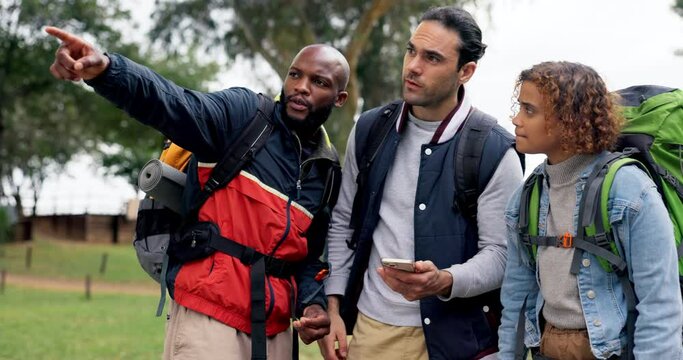 Friends, camping and lost with phone, search and direction with pointing, helping hand and adventure in nature. Men, woman and smartphone with map app, confused and questions for campsite location