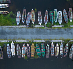 drone shot of small fishing and rowing boats on lough sheelin harbour, ireland © paultate