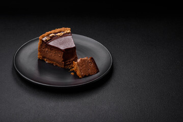 Delicious, fresh, sweet chocolate cake with nuts cut into slices
