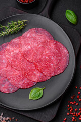 Delicious smoked salami sausage with salt, spices and herbs