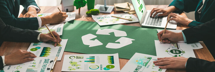 Group of business people planning and discussing on recycle reduce reuse policy symbol in office...