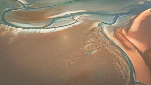 Aerial view of low tide with visible river bed by the beach Llanfairfechan, North Wales, Cymru, UK
