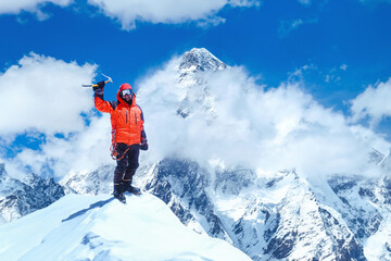 Fototapeta na wymiar Triumphant Climber Conquers Nepal's Majestic Mountain Peak. Everest Region