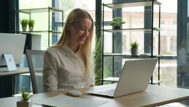 Caucasian girl excited woman talk video call computer conference happy businesswoman greeting friend online virtual meeting job interview smile show office workplace with laptop business communication