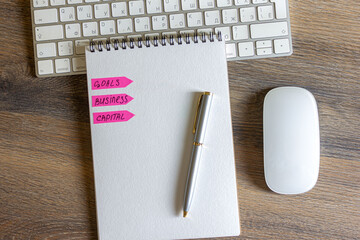 notebook and pen on wood