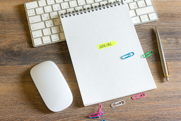 notebook and pen on wooden background