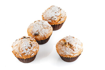 Sweet muffins. Cupcakes with raisins isolated on white background. Close-up