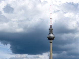 Alexanderplatz TV tower on the beautiful blue sky background with  clouds.