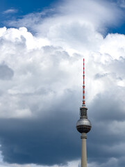 Fototapeta premium Alexanderplatz TV tower on the beautiful blue sky background with clouds.