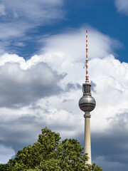 Fototapeta premium Alexanderplatz TV tower on the beautiful blue sky background with clouds.