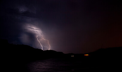Naklejka na ściany i meble Lightning bolts striking at Lake Mead Nevada