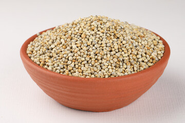Pearl millet or Bajra is the most widely grown type of millet. The Millet was placed in a blue bowl 