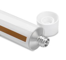 Open tube of ointment on white background, closeup. Space for text