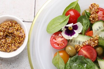 Delicious salad with vegetables, olives and grain mustard on light table, flat lay