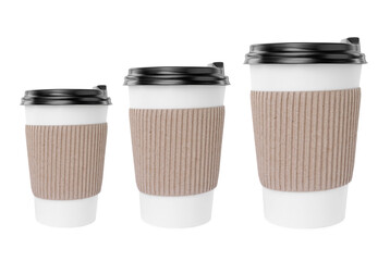 To-go drink. Set with three paper coffee cups of different sizes isolated on white