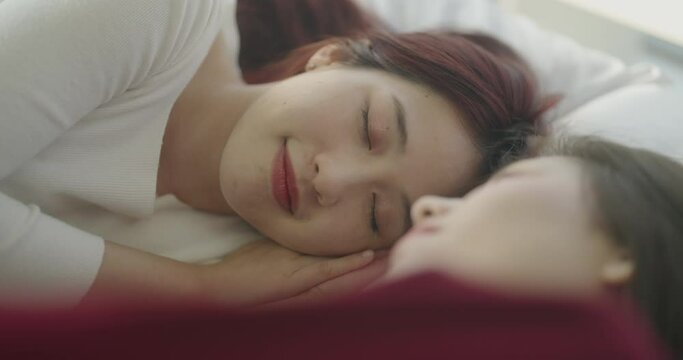 Roommate concept of 4k Resolution. Asian women waking up in bed in the morning together.