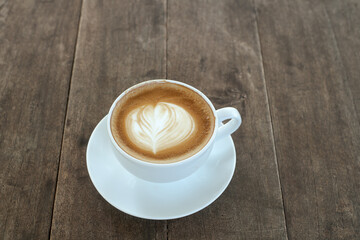 Top view of hot latte coffee with latte art in a ceramic cup