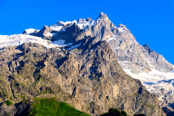 La Grave La Meije Ski off-piste resort, unique in Alps with single groomed slope on the glacier, freeride, view on peak La Meije, Massif des Ecrins, Hautes Alpes, France in summer