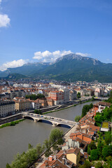 View on central part of Grenoble city from Bastille fortres witn mountains around, old cable car,...