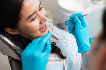 Healthcare and medicine concept.young woman checking her results in the dentists office.